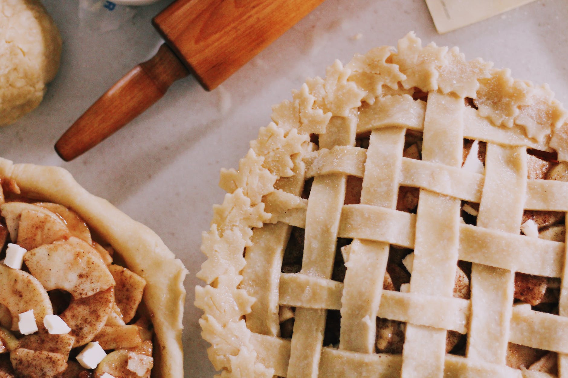 two assorted pies on table