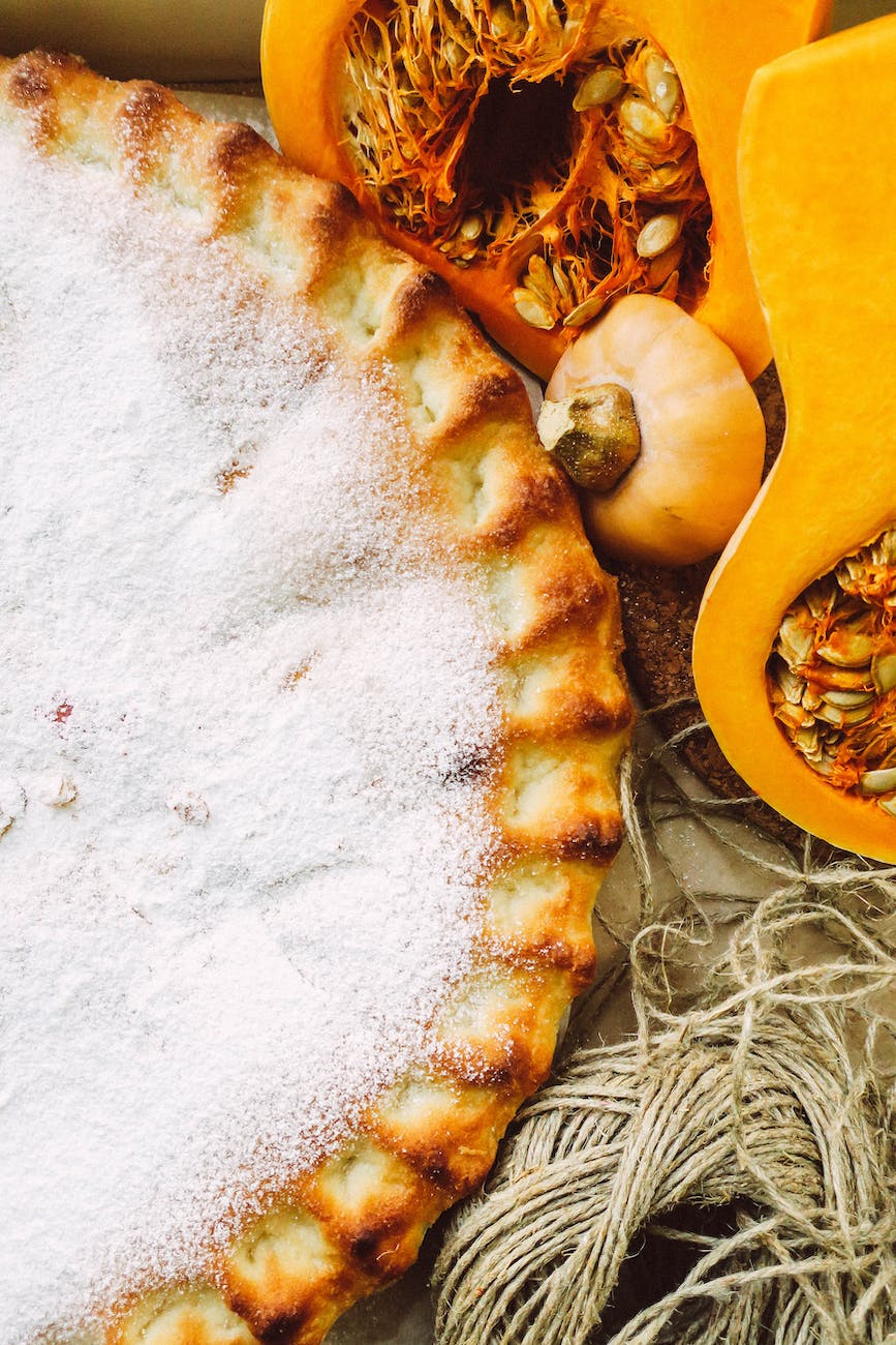 close up of a pie and pumpkins